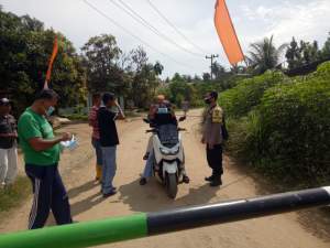 Cegah Penyebaran Covid 19, Polsek Dolok Masihul Lakukan Penyekatan Masyarakat